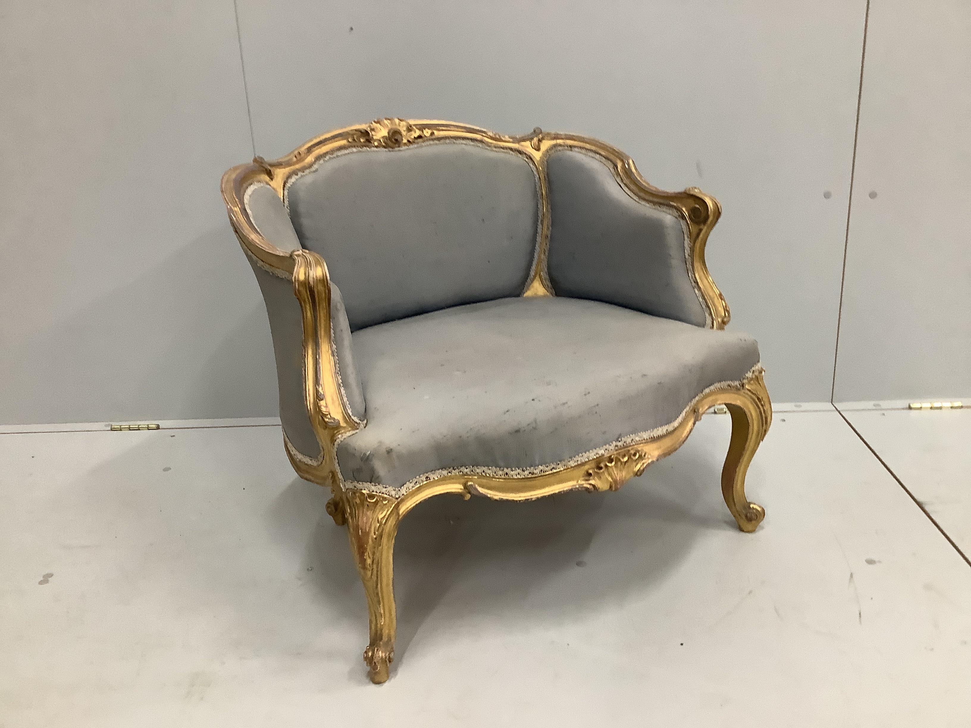 A Victorian carved giltwood and composition upholstered salon chair, width 70cm, depth 60cm, height 67cm